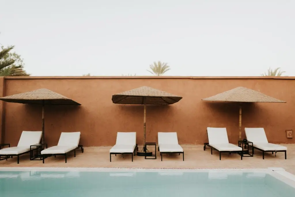 Sun loungers by hotel pool, Douba, Morocco